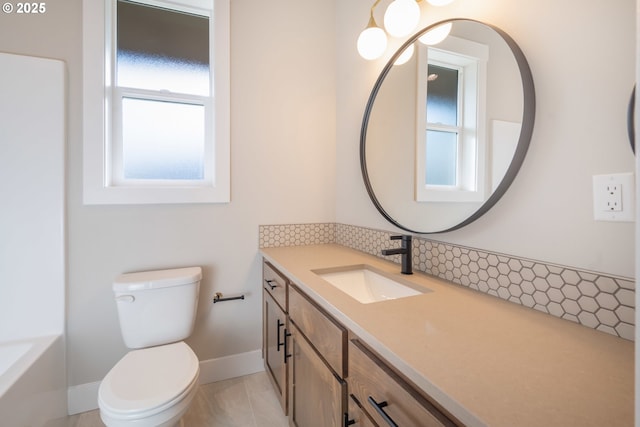 bathroom with vanity, tile patterned floors, and toilet