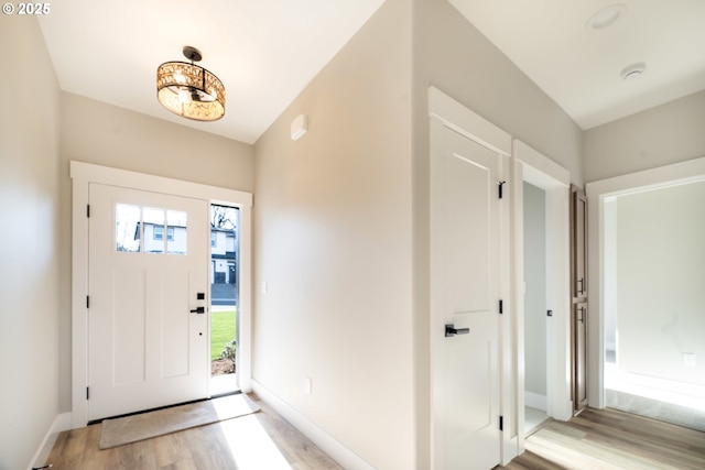 foyer with light wood-type flooring