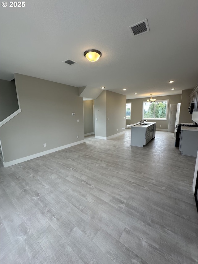 1775 S Murphy Dr, Newberg, OR 97132 - unfurnished living room featuring recessed lighting and a chandelier