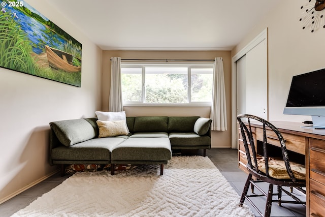 office featuring tile patterned floors and baseboards