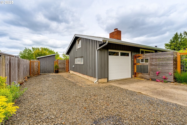 garage featuring driveway