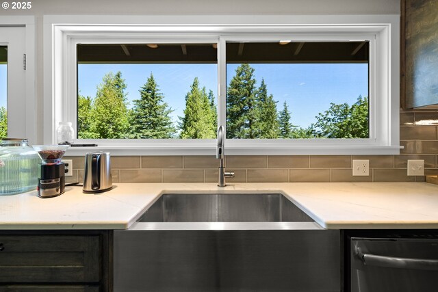 37333 NE Reed Rd, Corbett, OR 97019 - kitchen with stainless steel dishwasher, backsplash, and light stone counters