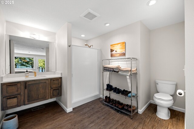 37333 NE Reed Rd, Corbett, OR 97019 - full bathroom featuring wood finished floors, vanity, a shower, and recessed lighting