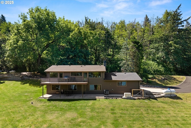 37333 NE Reed Rd, Corbett, OR 97019 - back of property featuring a patio, a deck, a yard, and a chimney