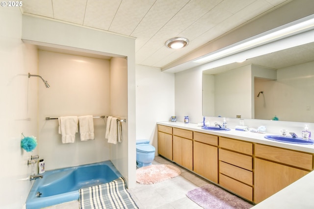 full bathroom with tile patterned floors, toilet, double vanity, a bath, and a sink