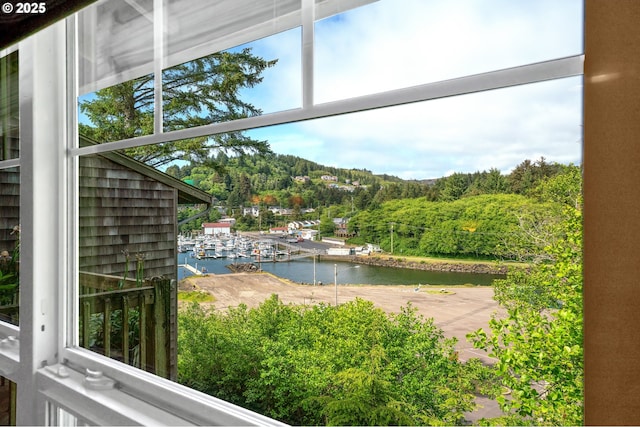 425 SE Shell Ave Unit 4, Depoe Bay, OR 97341 - water view with a heavily wooded area