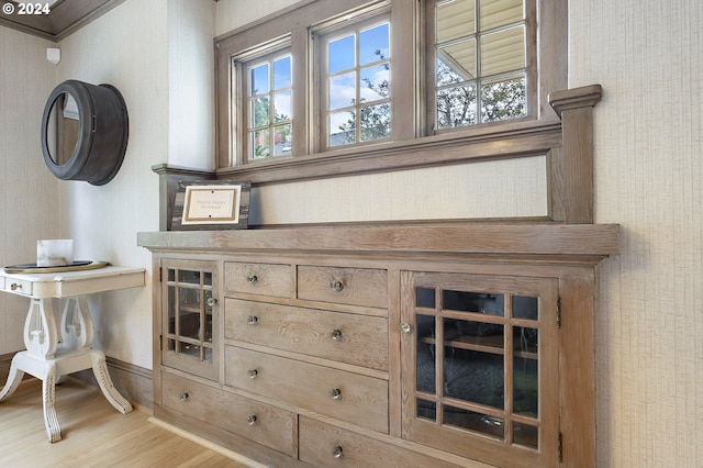 details with wood finished floors and wallpapered walls