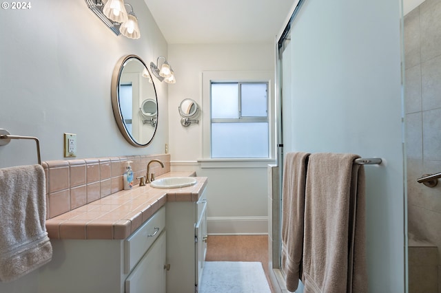 bathroom with vanity and baseboards