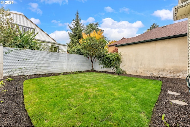 view of yard with a fenced backyard