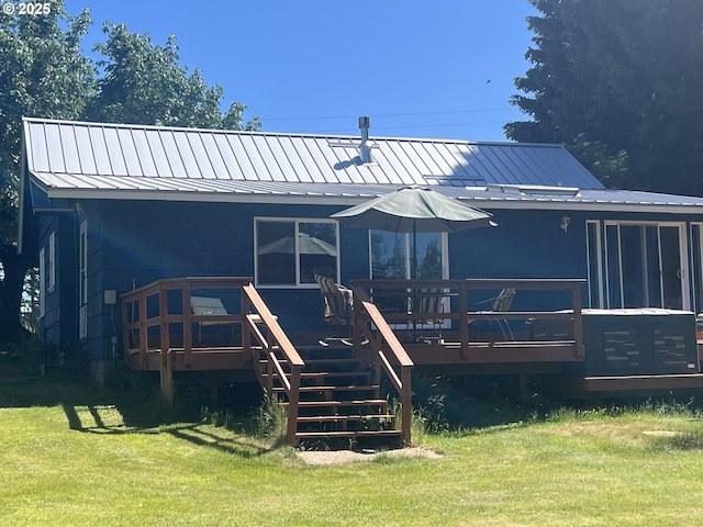 235 Bates Rd, White Salmon, WA 98672 - rear view of house featuring a standing seam roof, a lawn, a metal roof, stairs, and a wooden deck