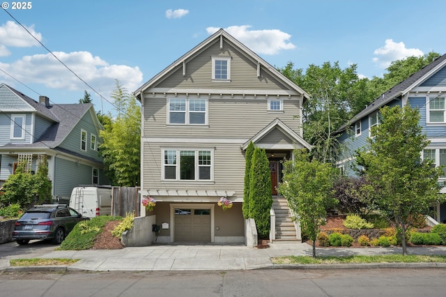 665 NE Skidmore St, Portland, OR 97211 - view of front facade with a garage, stairs, and concrete driveway