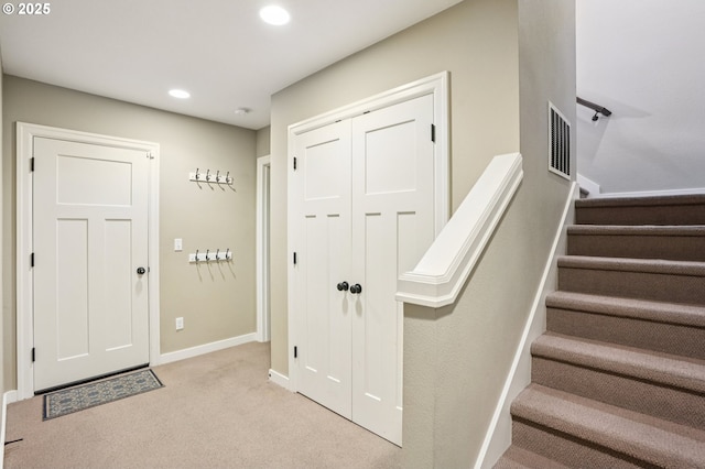665 NE Skidmore St, Portland, OR 97211 - carpeted entryway with stairs and recessed lighting