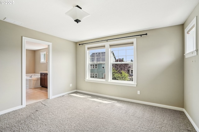 665 NE Skidmore St, Portland, OR 97211 - spare room featuring carpet flooring and plenty of natural light