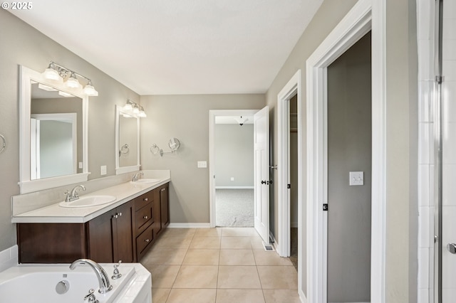 665 NE Skidmore St, Portland, OR 97211 - bathroom with double vanity, a garden tub, and tile patterned floors