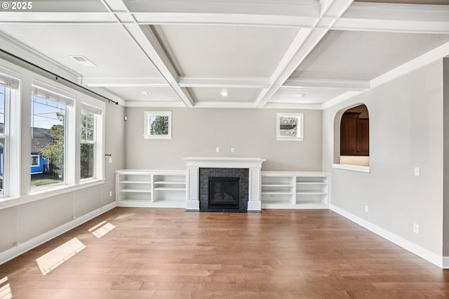 665 NE Skidmore St, Portland, OR 97211 - unfurnished living room with light wood-type flooring, a brick fireplace, beamed ceiling, and coffered ceiling