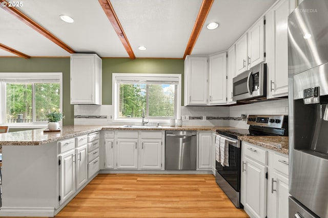 20740 S Shelley Ln, Beavercreek, OR 97004 - kitchen featuring appliances with stainless steel finishes, plenty of natural light, white cabinets, and recessed lighting