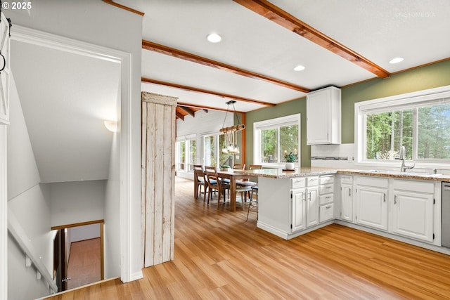 20740 S Shelley Ln, Beavercreek, OR 97004 - kitchen with light wood-type flooring, beamed ceiling, white cabinetry, recessed lighting, and light stone countertops