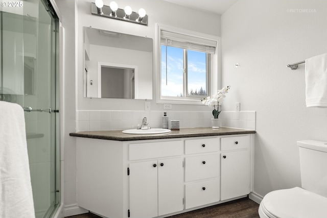 20740 S Shelley Ln, Beavercreek, OR 97004 - bathroom featuring vanity, backsplash, a shower stall, and wood finished floors