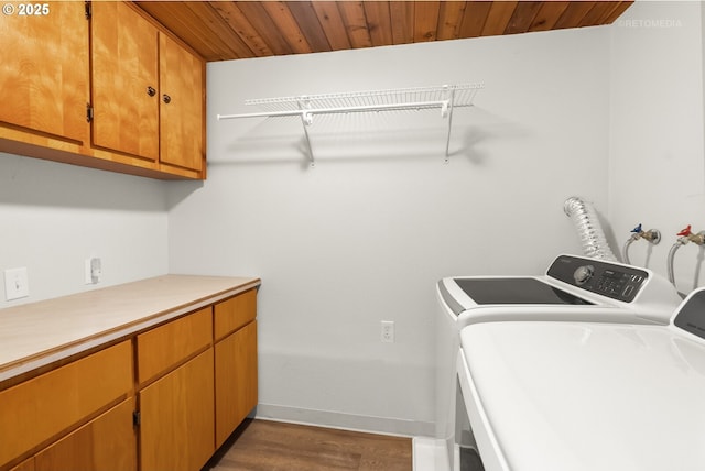 20740 S Shelley Ln, Beavercreek, OR 97004 - washroom featuring independent washer and dryer, cabinet space, wooden ceiling, and dark wood finished floors