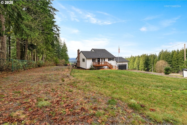 20740 S Shelley Ln, Beavercreek, OR 97004 - back of house with a wooden deck, a chimney, and a garage