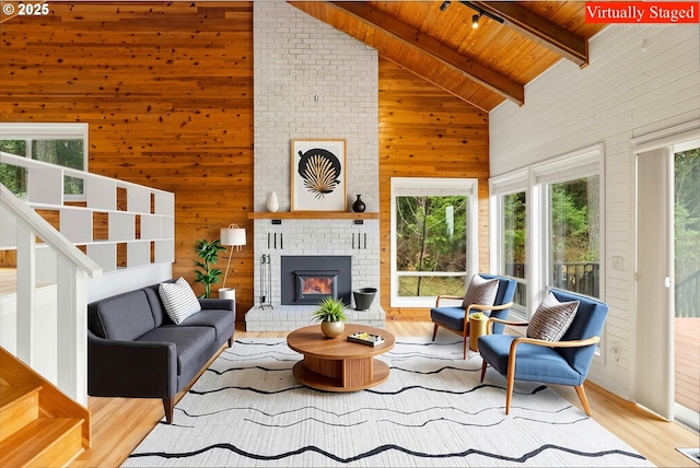 20740 S Shelley Ln, Beavercreek, OR 97004 - living area featuring a wood ceiling with exposed beams, wooden walls, plenty of natural light, high vaulted ceiling, and wood finished floors