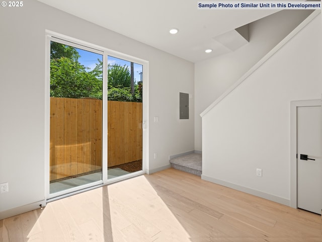 1612 SE Morrison St Unit 2, Portland, OR 97214 - entryway featuring electric panel, light wood-type flooring, recessed lighting, and baseboards