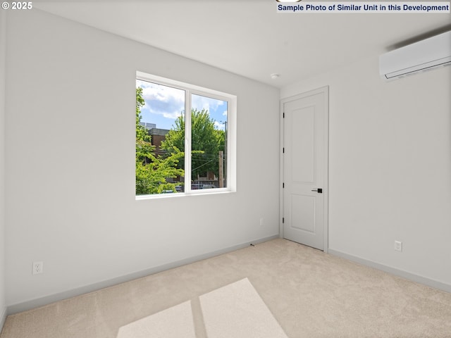 1612 SE Morrison St Unit 2, Portland, OR 97214 - empty room with carpet flooring, a wall mounted AC, and baseboards