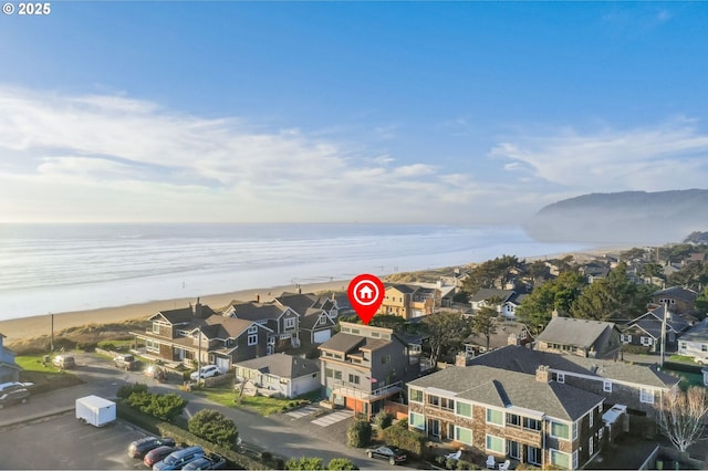 birds eye view of property featuring a water view and a residential view