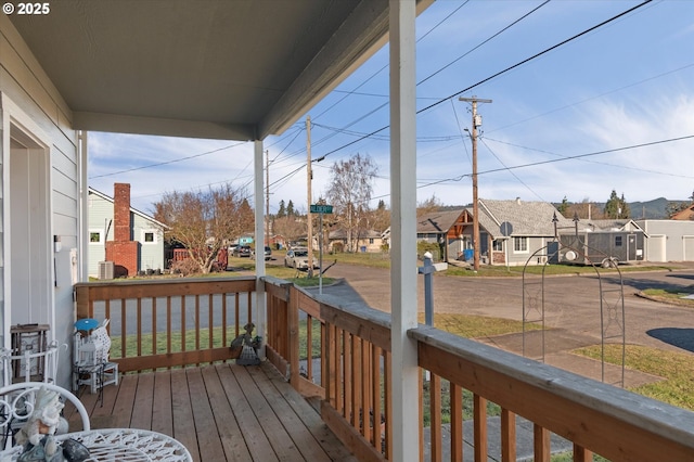 wooden deck featuring covered porch