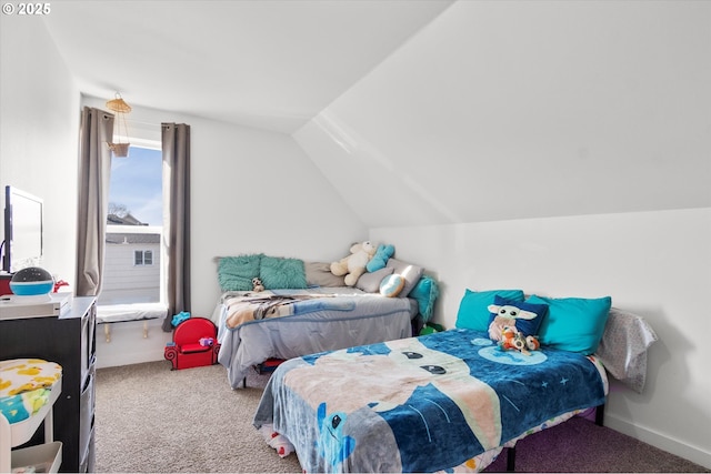 bedroom featuring light colored carpet and lofted ceiling