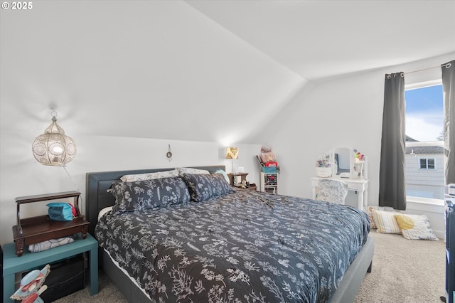 carpeted bedroom with lofted ceiling