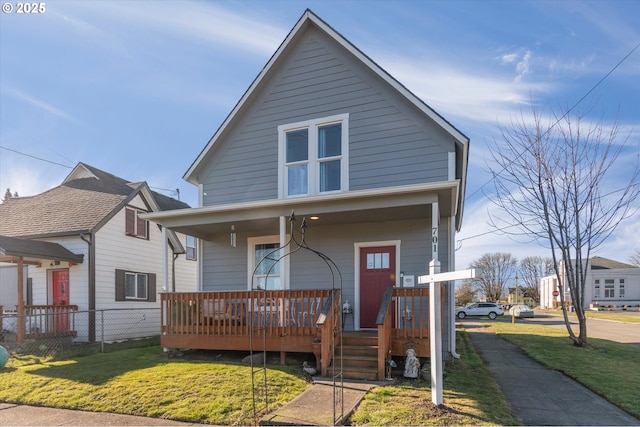 view of front of property featuring a porch and a front lawn