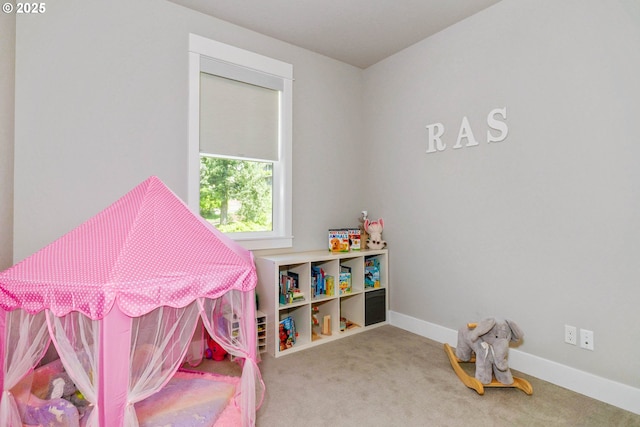 recreation room with carpet flooring and baseboards