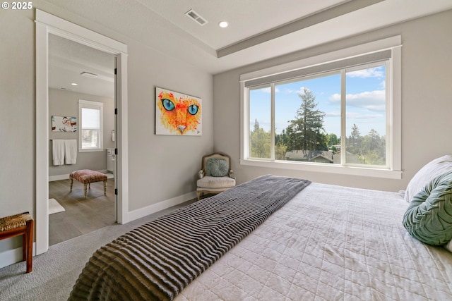 bedroom featuring baseboards, visible vents, wood finished floors, and recessed lighting