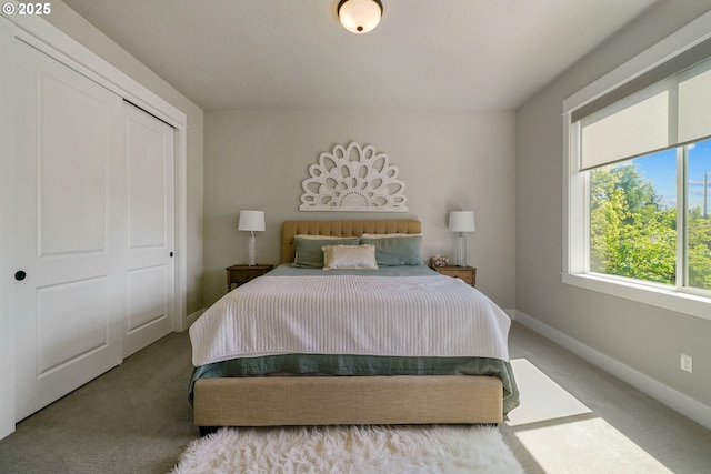 carpeted bedroom with baseboards