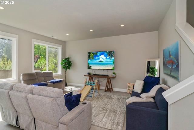 living area with recessed lighting and baseboards