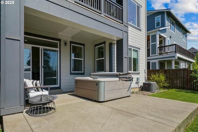 view of patio featuring central AC, a fire pit, and fence