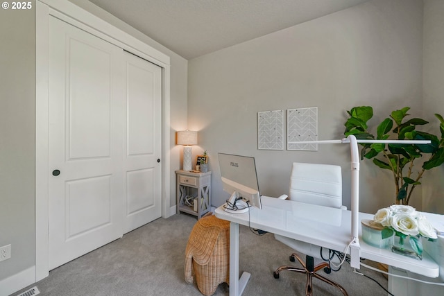 home office featuring carpet flooring