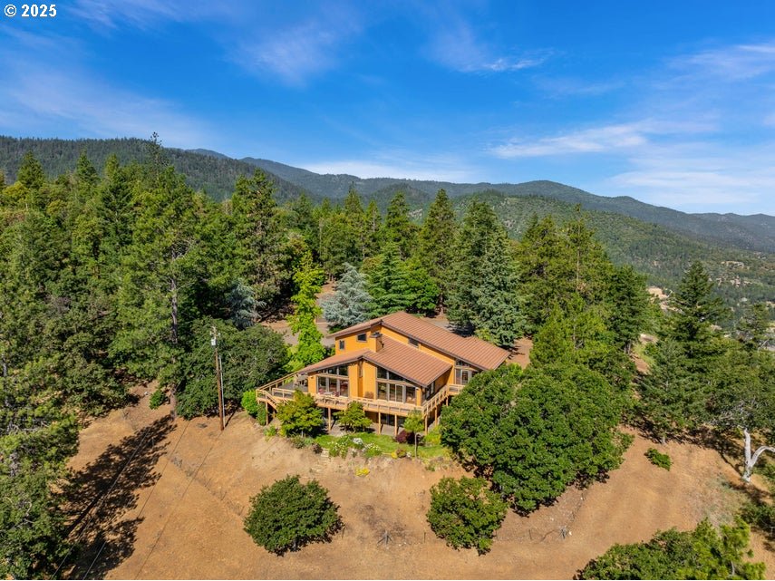 1999 Tolman Creek Rd, Ashland, OR 97520 - view from above of property with a forest and a mountain backdrop
