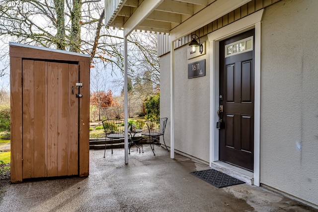 view of exterior entry with stucco siding