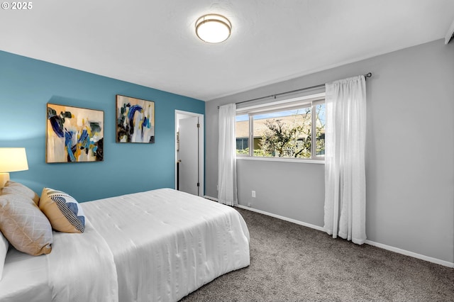 carpeted bedroom featuring baseboards