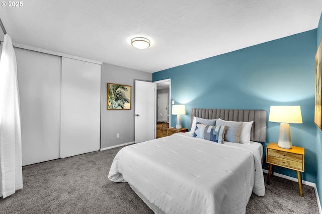 bedroom with carpet floors, a closet, and baseboards