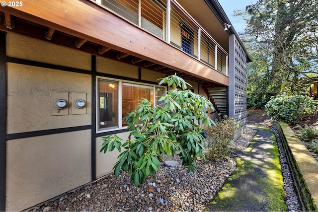 view of side of home featuring stucco siding