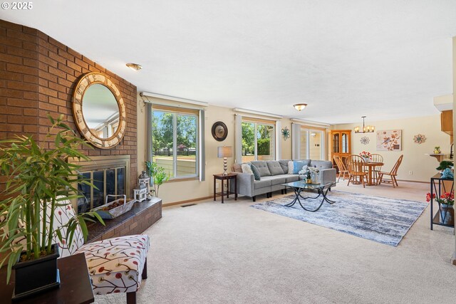 2935 Cedarwood Ct, Albany, OR 97322 - living room featuring carpet, a fireplace, and a chandelier