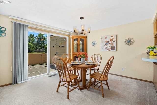 2935 Cedarwood Ct, Albany, OR 97322 - dining room featuring a chandelier and light carpet