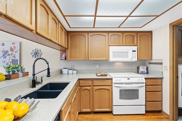 2935 Cedarwood Ct, Albany, OR 97322 - kitchen with white appliances, light wood finished floors, and washer / dryer