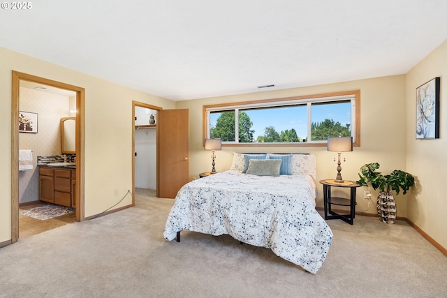 2935 Cedarwood Ct, Albany, OR 97322 - bedroom with light carpet, connected bathroom, and a walk in closet
