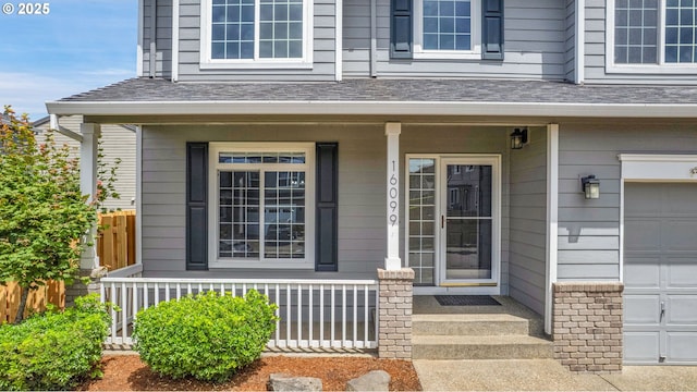 16099 SE Venice Ridge Way, Damascus, OR 97089 - view of exterior entry featuring covered porch and roof with shingles