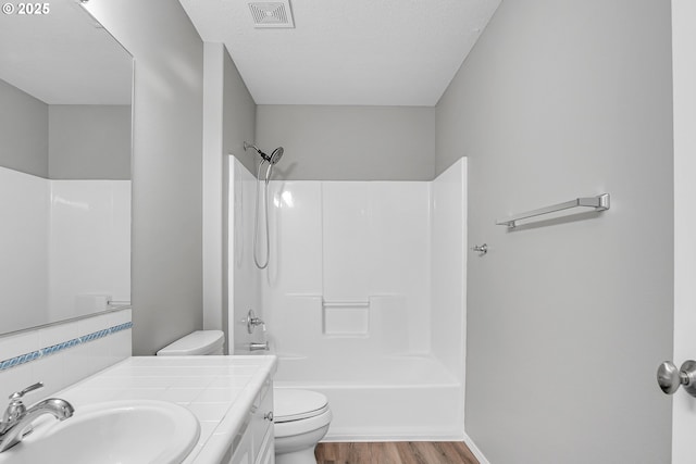 16099 SE Venice Ridge Way, Damascus, OR 97089 - full bathroom featuring wood finished floors, vanity, shower / tub combination, and decorative backsplash