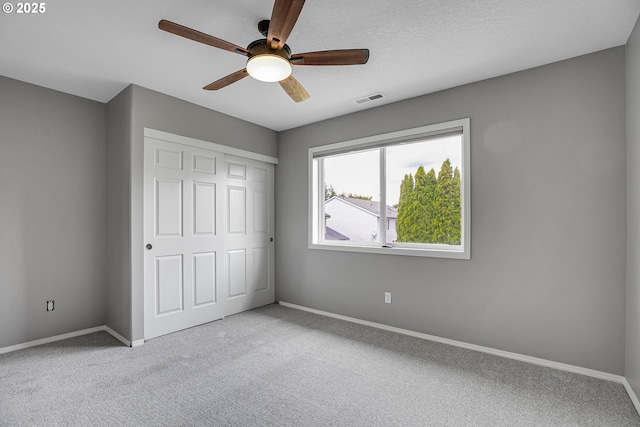 16099 SE Venice Ridge Way, Damascus, OR 97089 - unfurnished bedroom featuring carpet, a closet, and ceiling fan